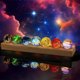 thumbnail image 1 of Esferas de 7 Chakras de Cuarzo de 40 mm con Base LED de Madera, 1 of 3