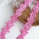 thumbnail image 1 of Cinta decorativa simpleSS 3 yd Rosa con encaje de flores de 45 mm, 1 of 6