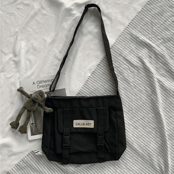 Upgrade Your Preppy Style with Our Trendy Shoulderbag - Perfect for Students! Featuring a Cute Cartoon Decor and Spacious Interior with Plastic Buckle and Zipper Closure.