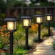 thumbnail image 1 of Luzes solares al aire libre, 12 paquetes de luces solares del camino impermeables, iluminación del paisaje para el camino del paseo del césped del jardín del patio de la decoración exterior, negro, 1 of 3